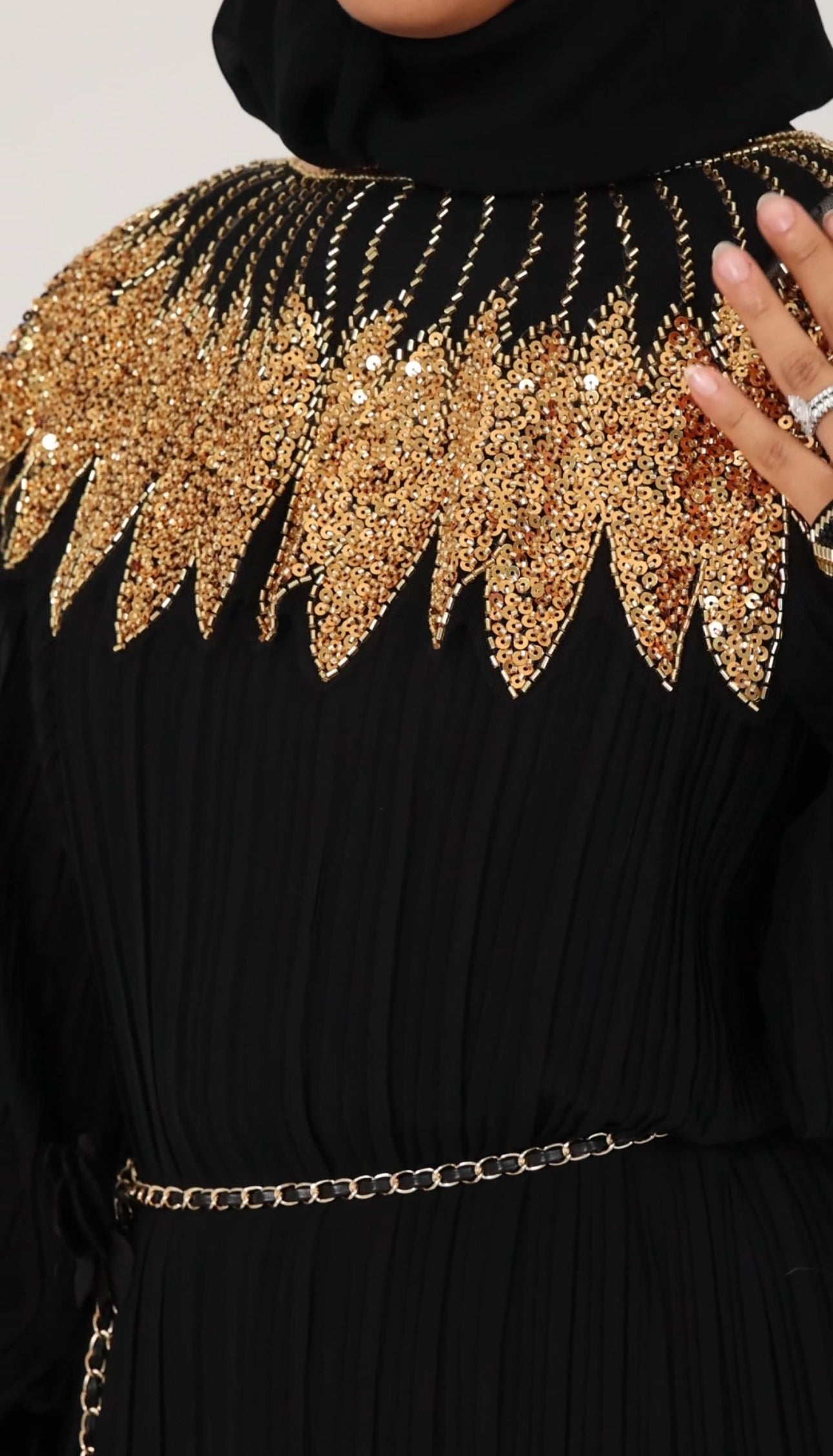 Black pleated dress with gold beads