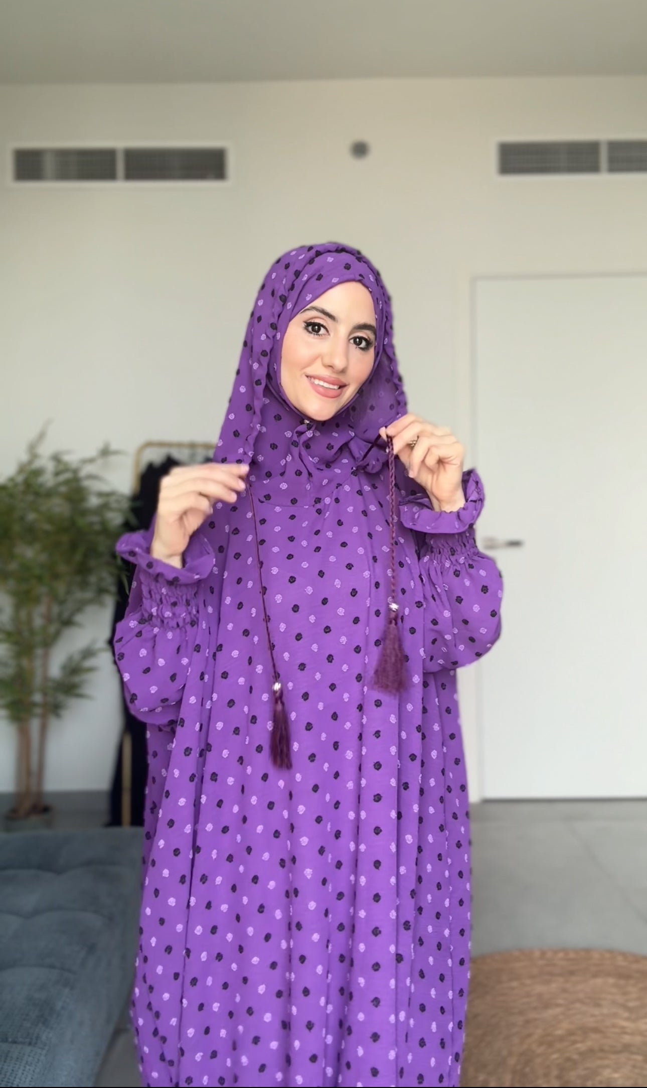 Bright purple burqa with black dots