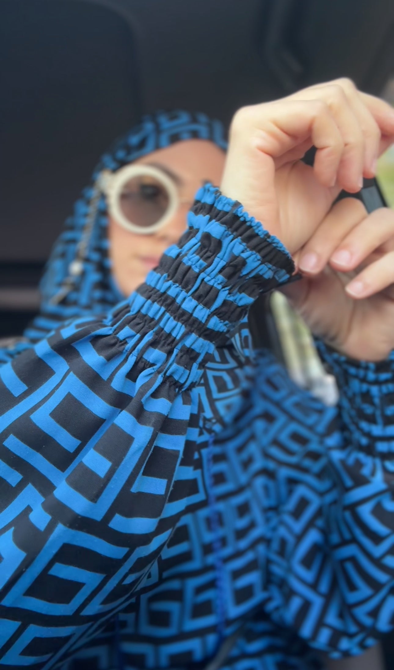 Blue burqa with black geometric lines