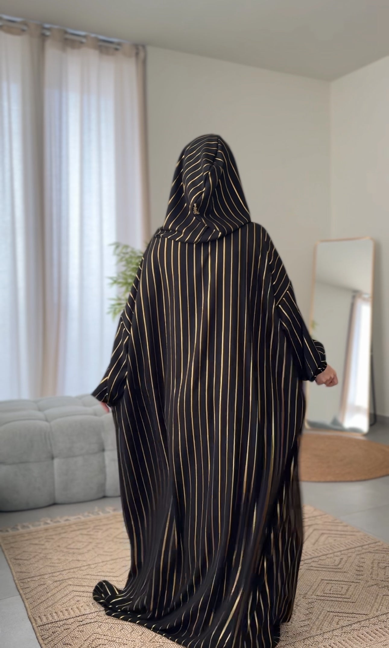 Black burqa with thin gold vertical lines