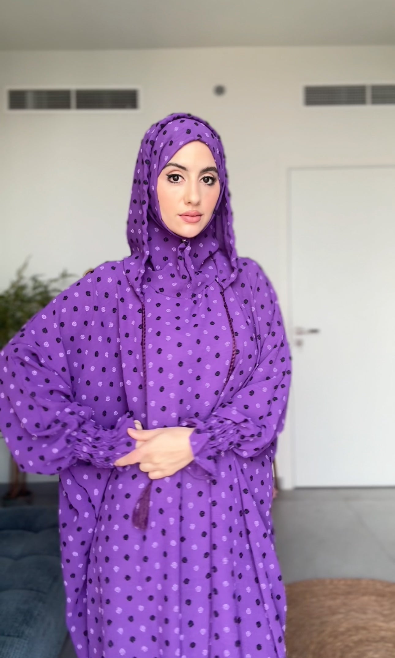 Bright purple burqa with black dots