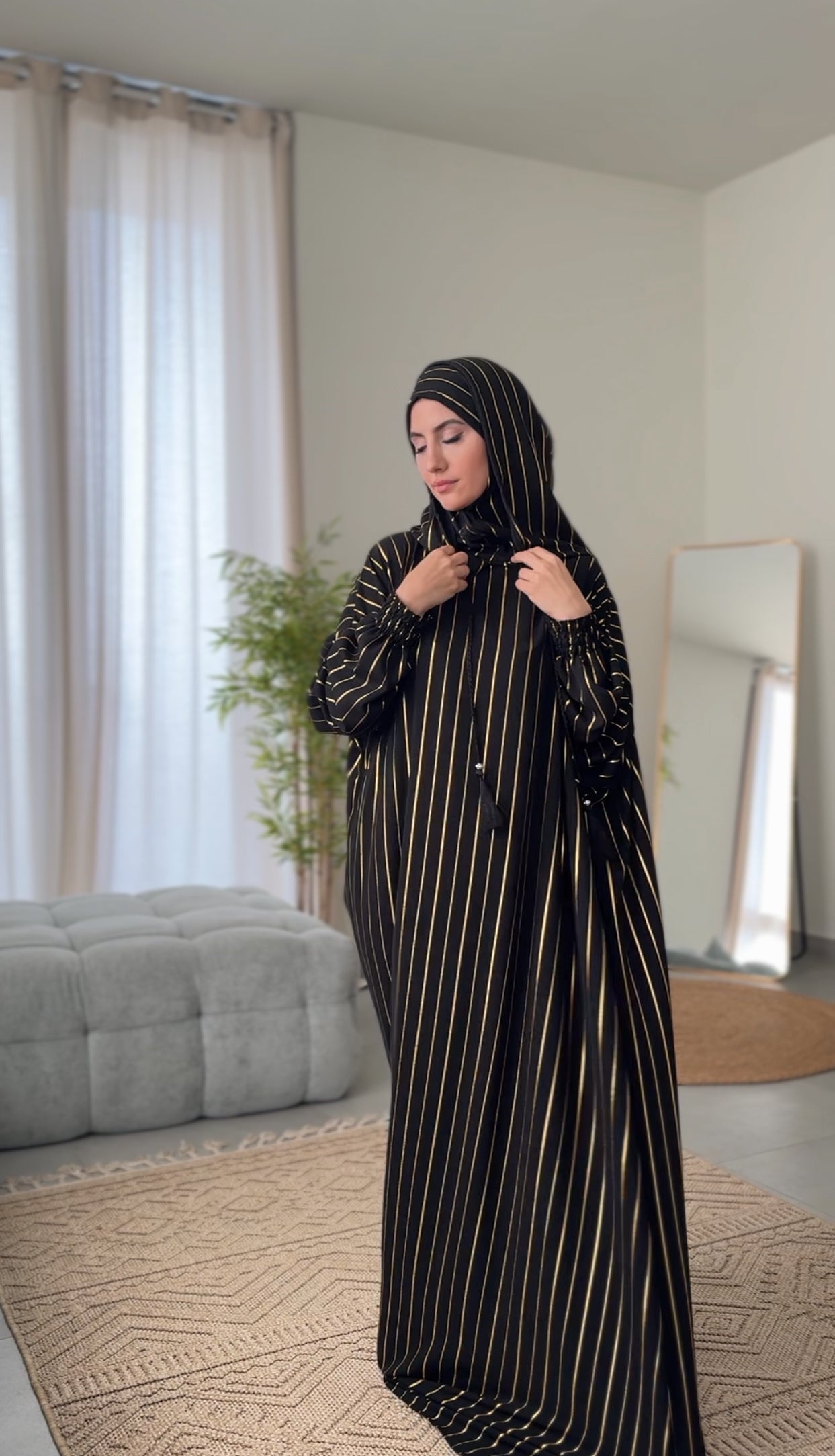 Black burqa with thin gold vertical lines