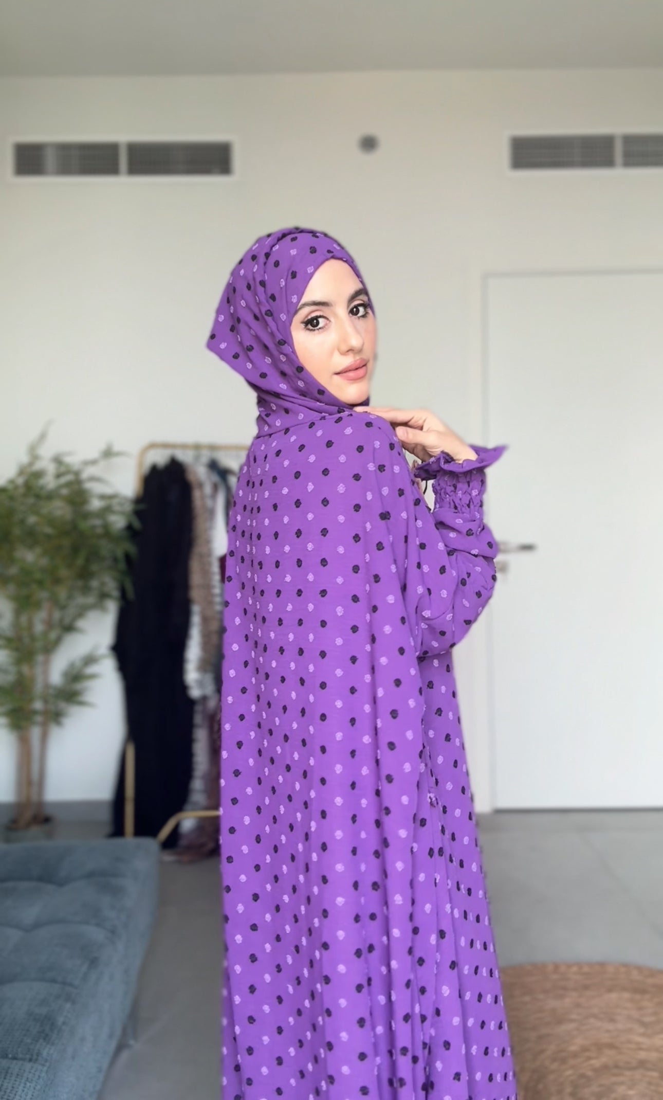 Bright purple burqa with black dots