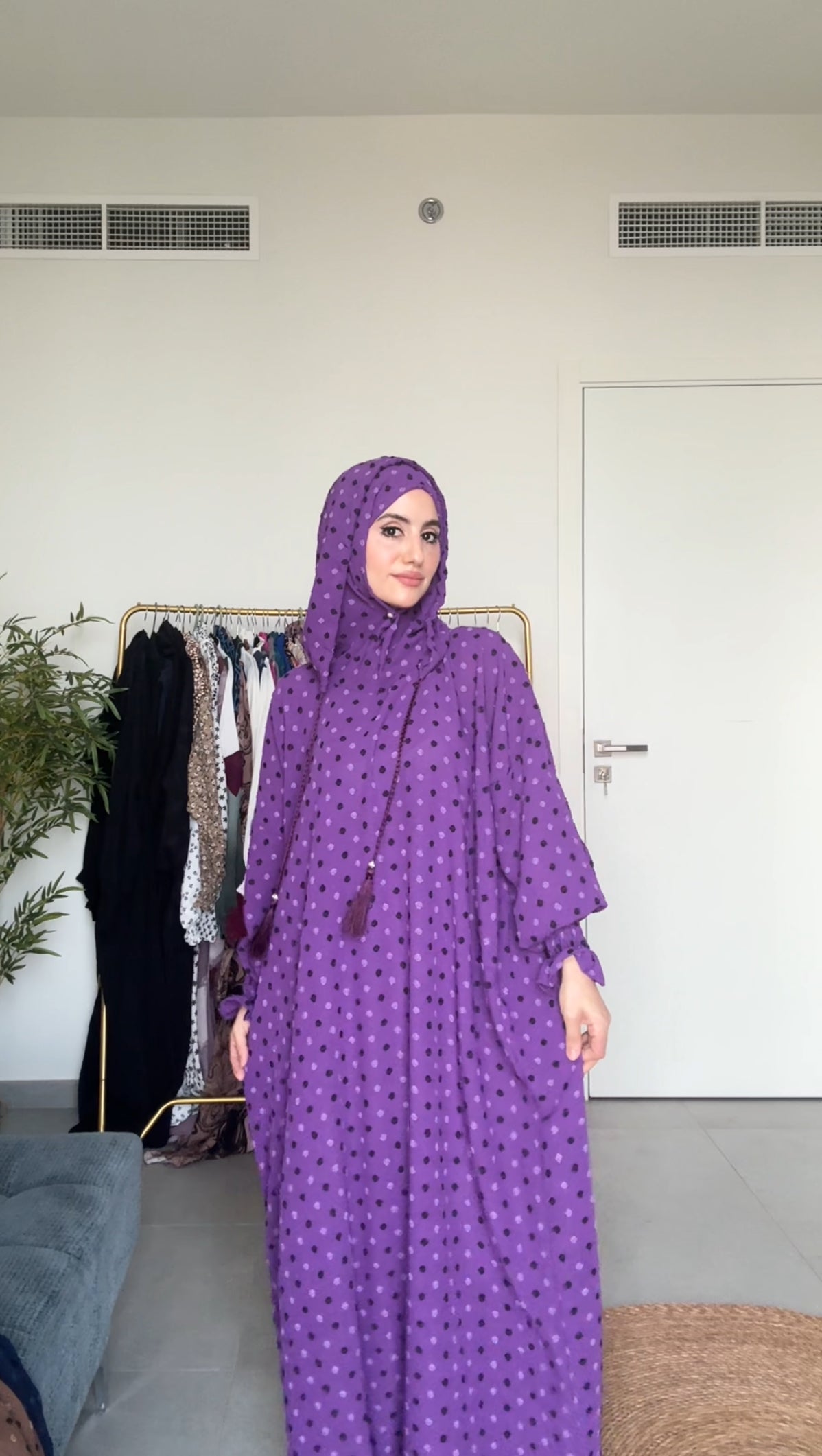 Bright purple burqa with black dots