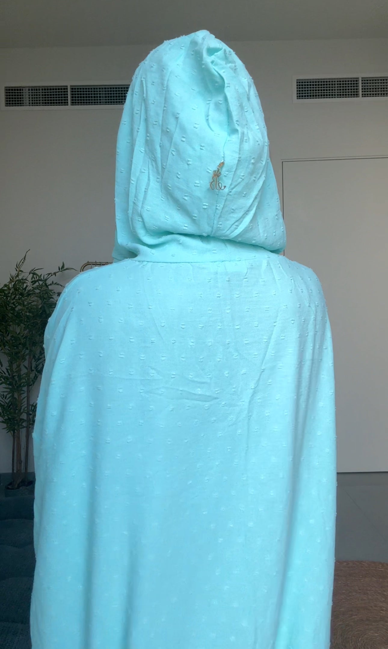 Bright blue burqa with blue dots