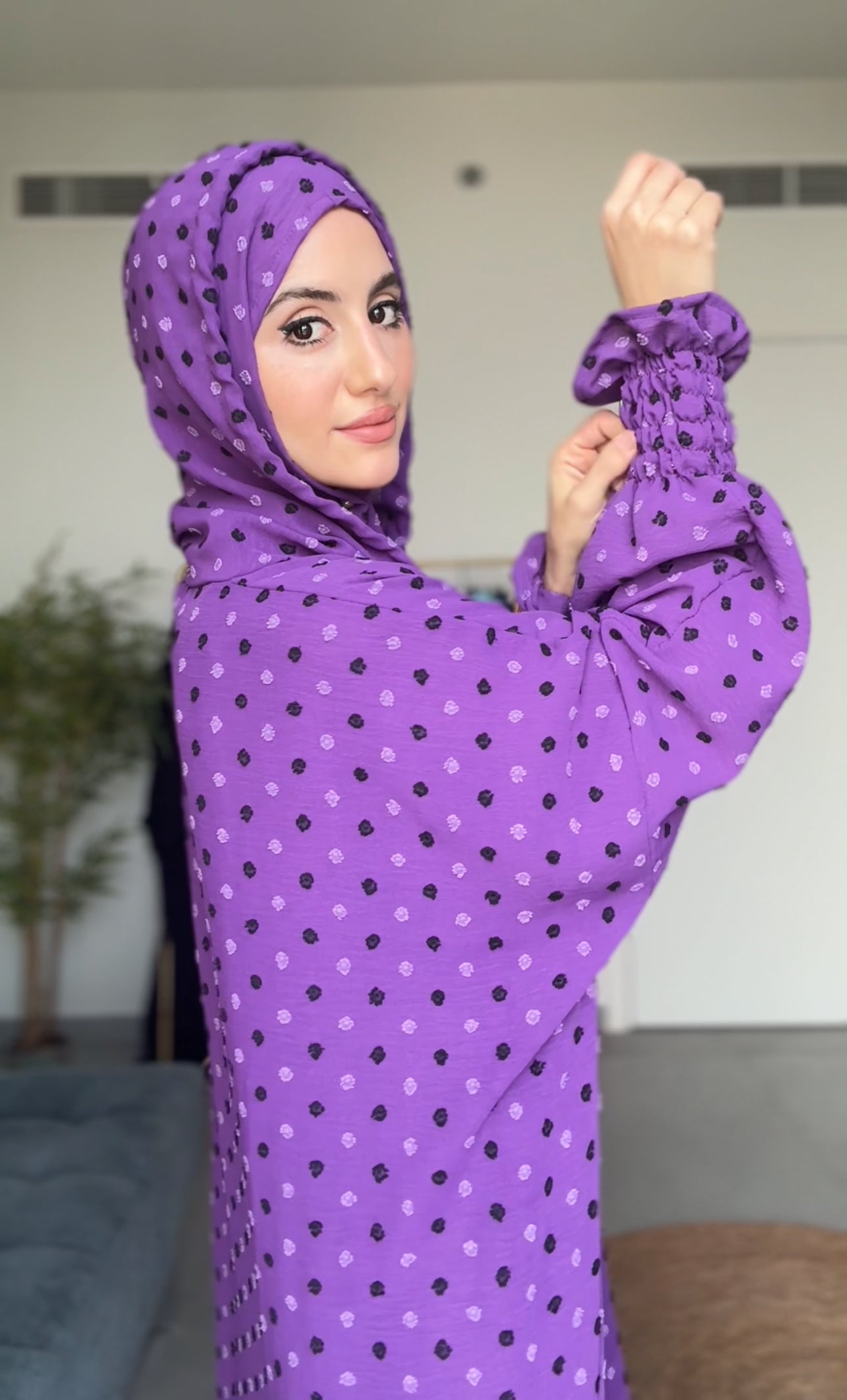 Bright purple burqa with black dots