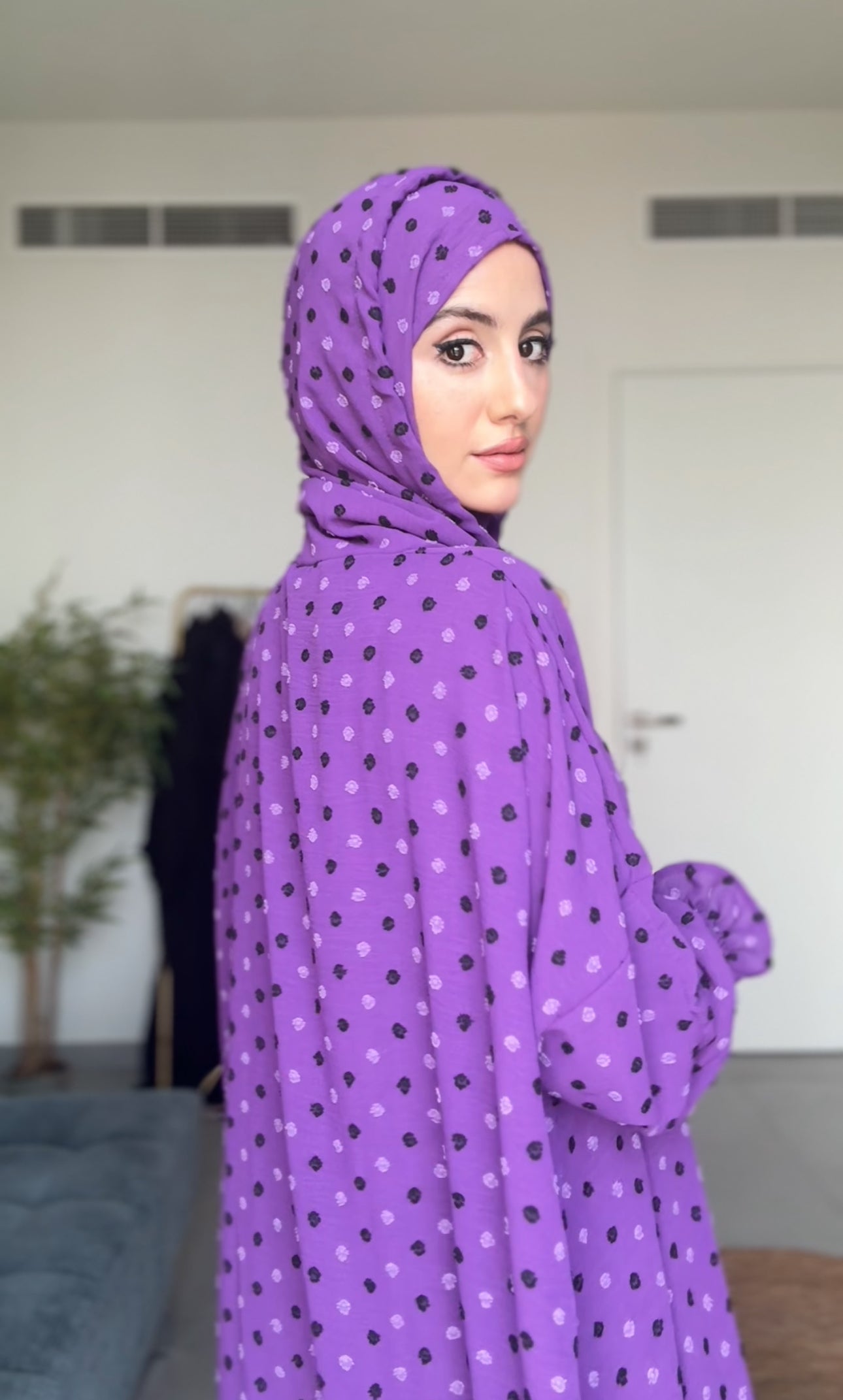 Bright purple burqa with black dots