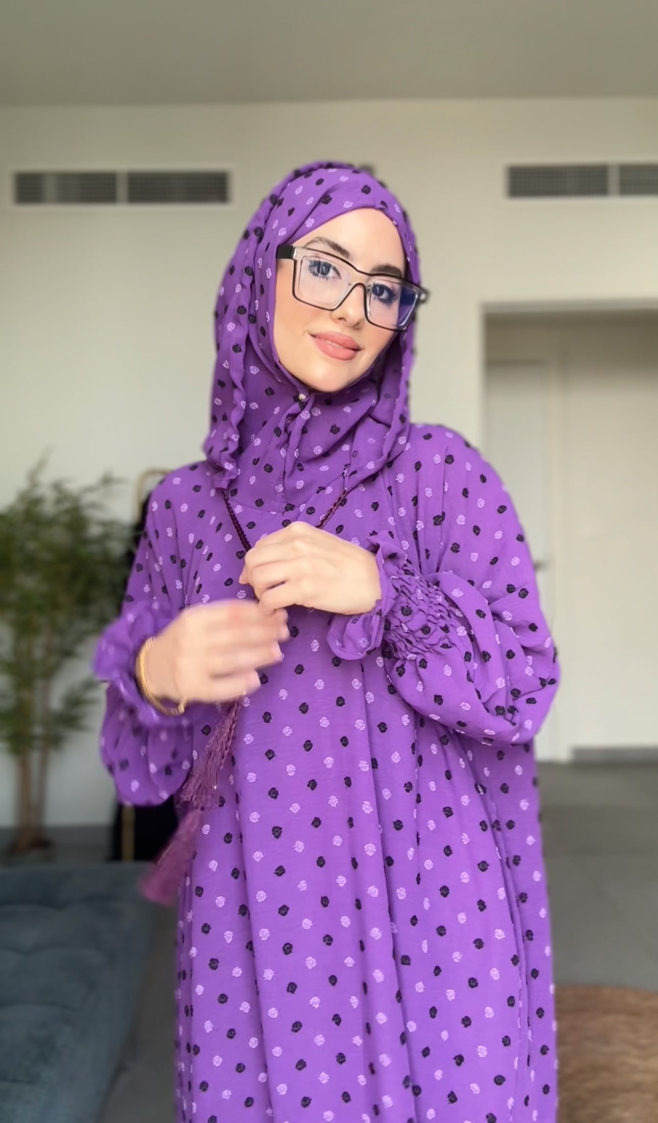 Bright purple burqa with black dots