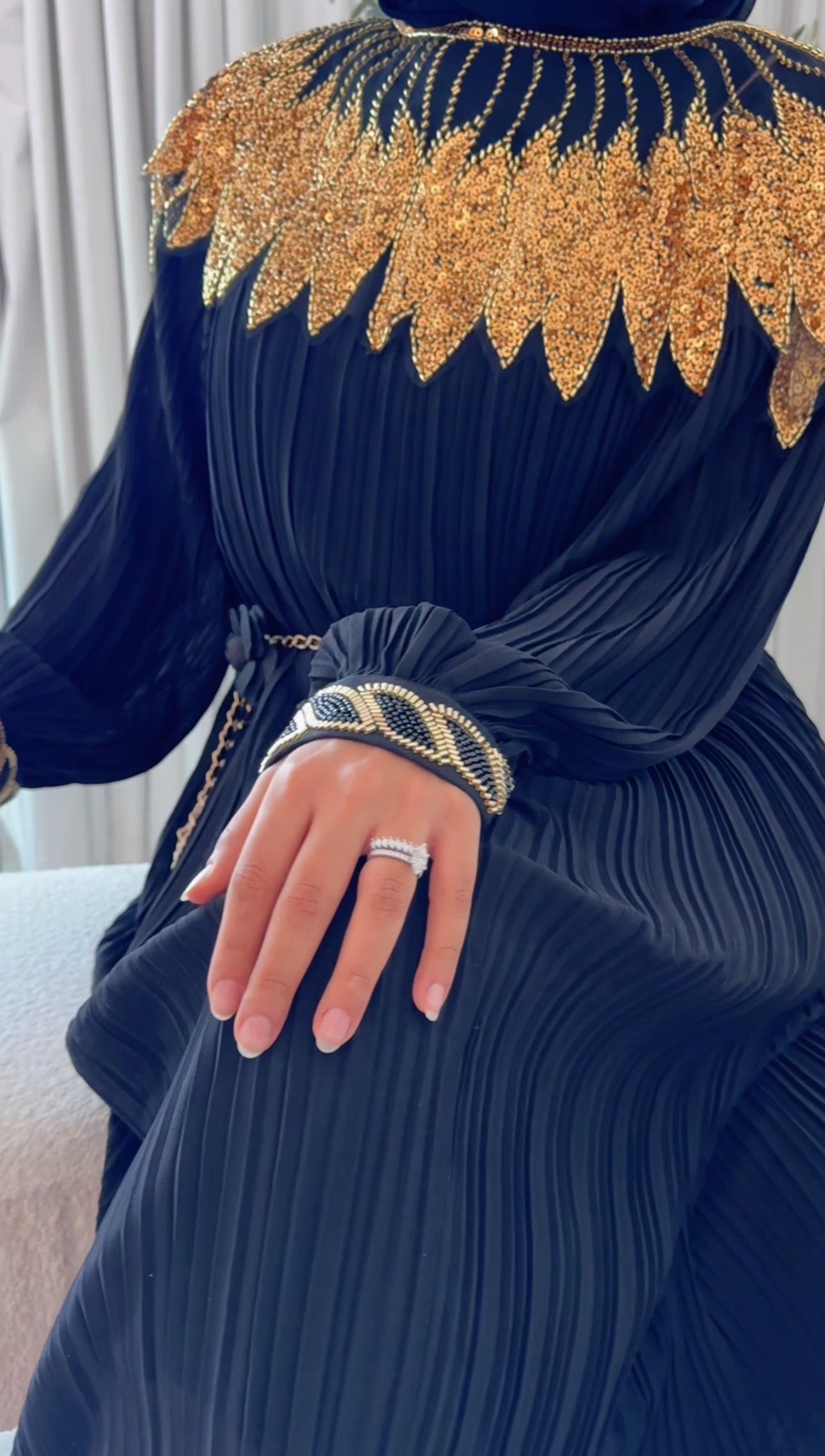 Black pleated dress with gold beads