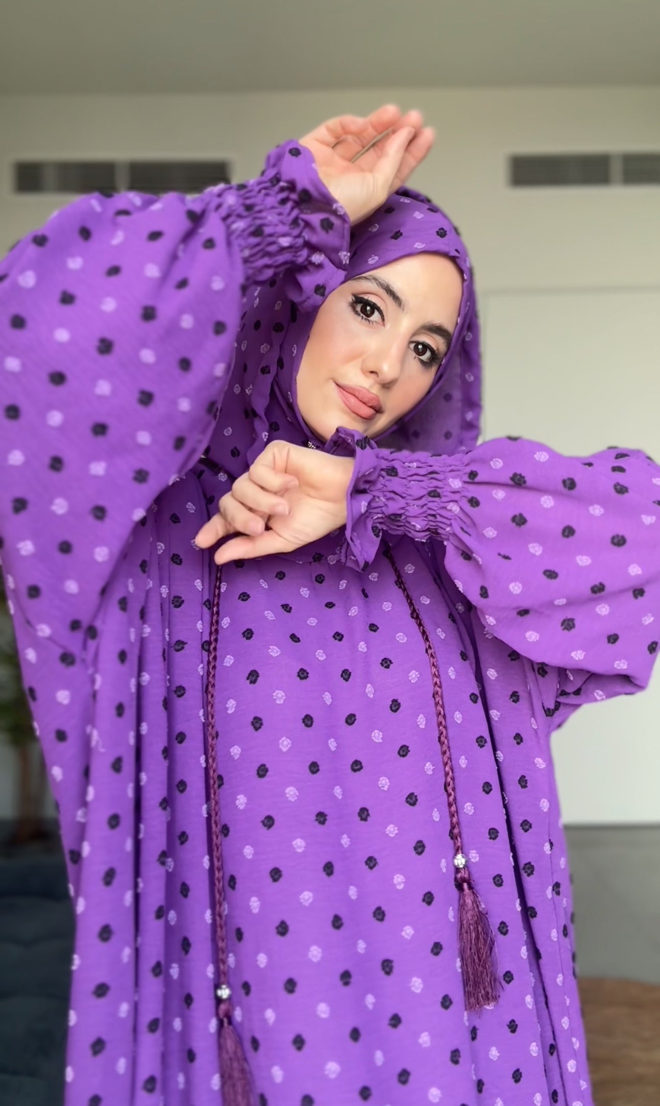 Bright purple burqa with black dots