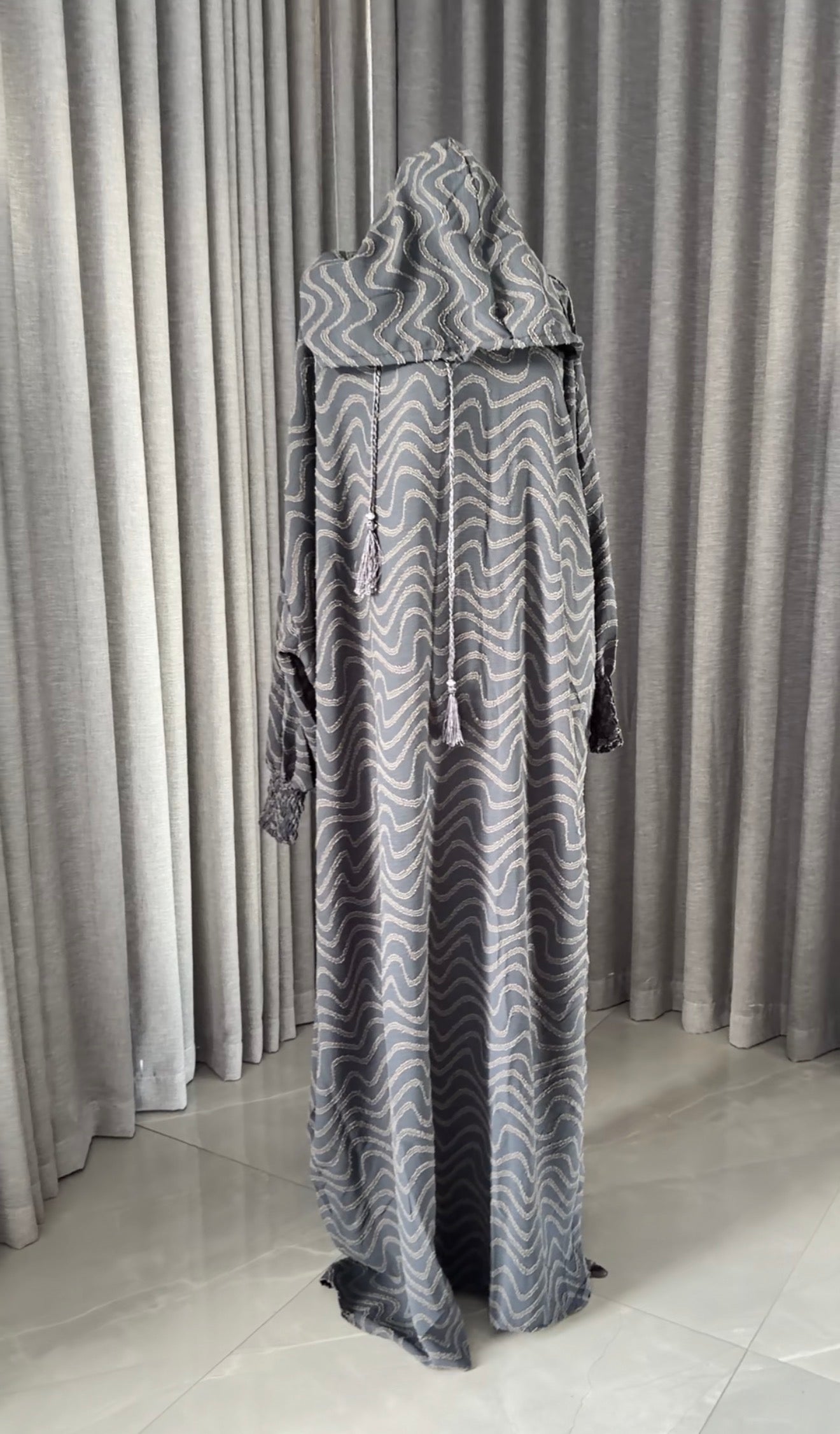 Dark gray burqa with wavy lines
