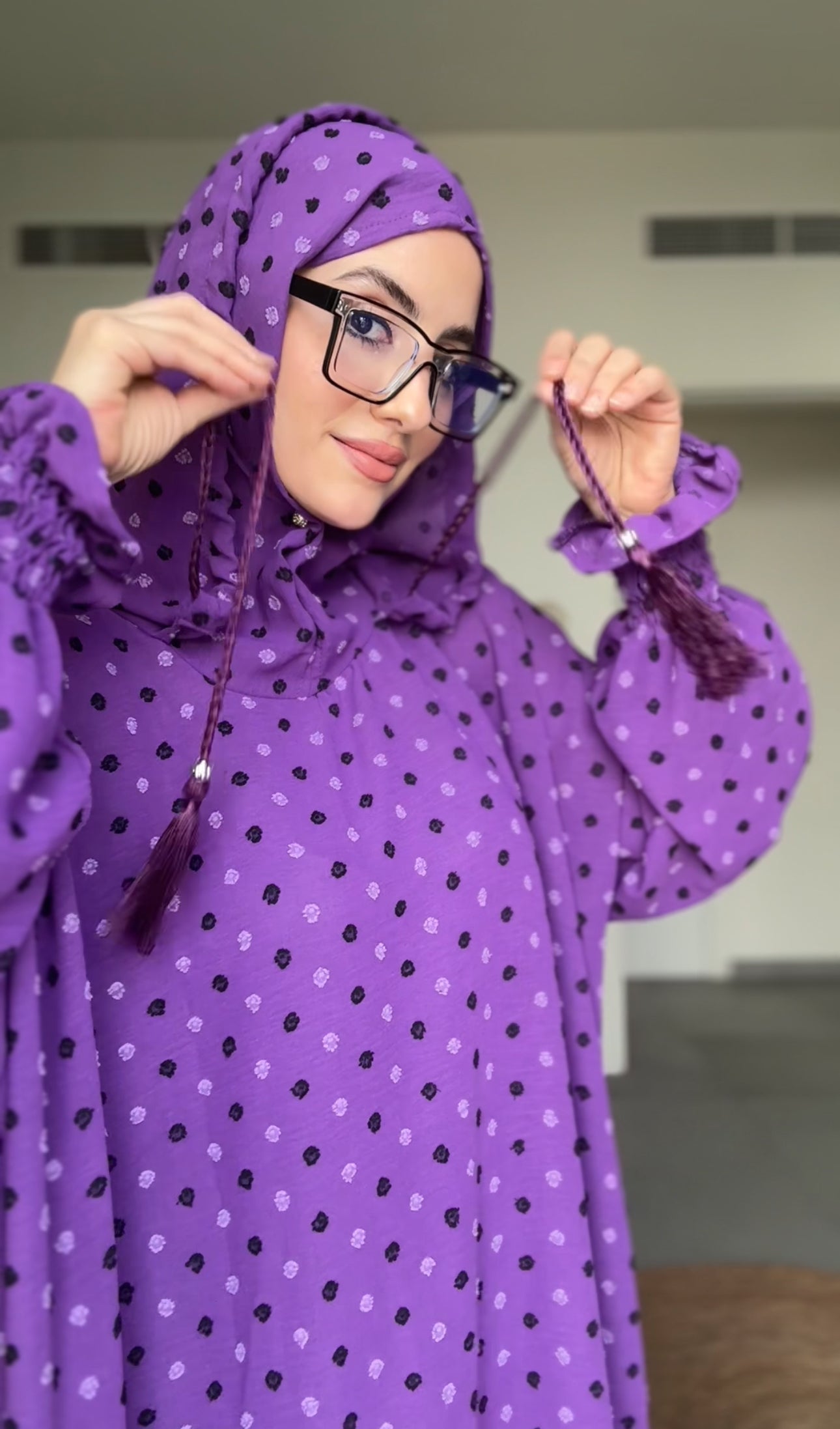 Bright purple burqa with black dots