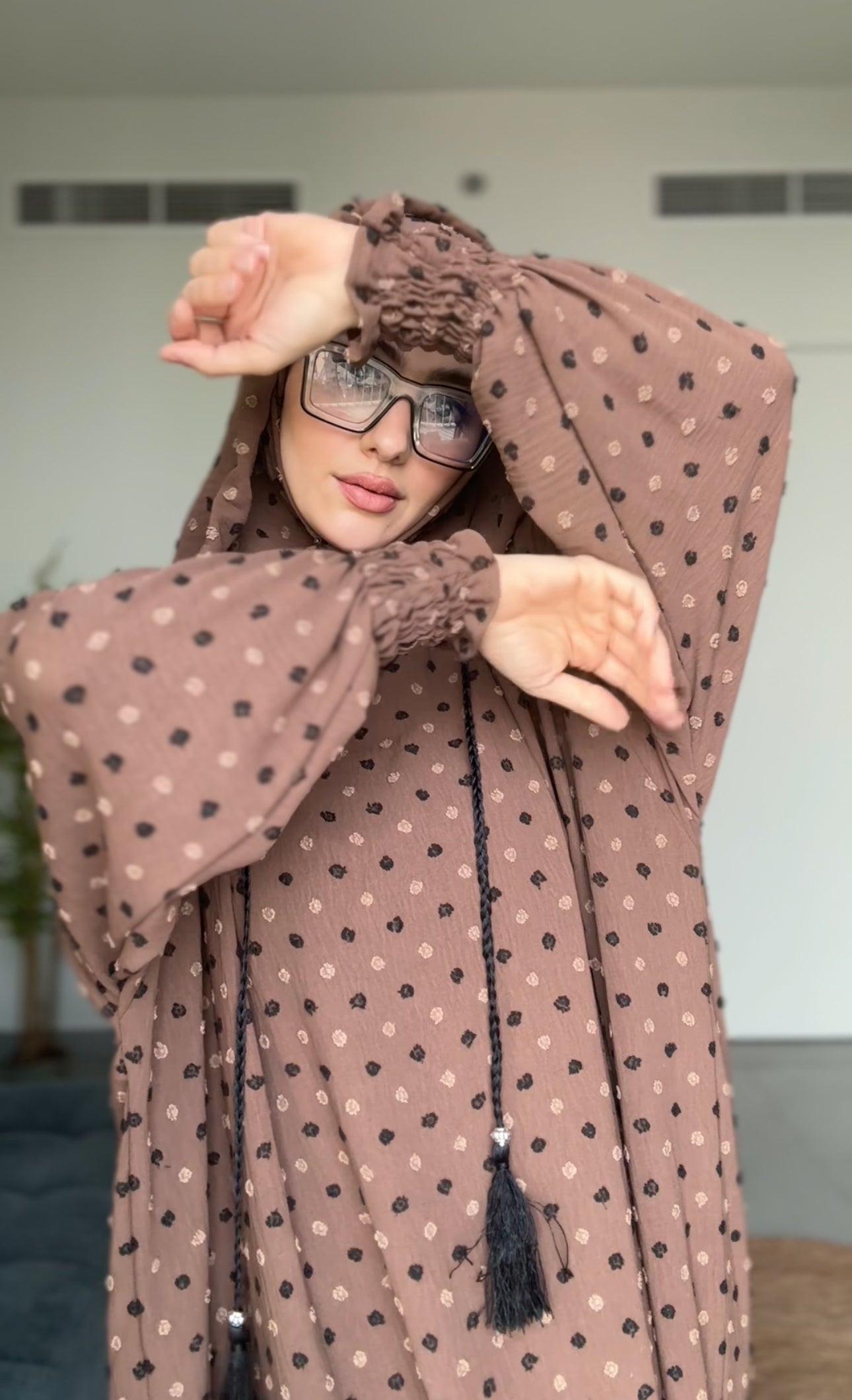 Brown burqa with black dots