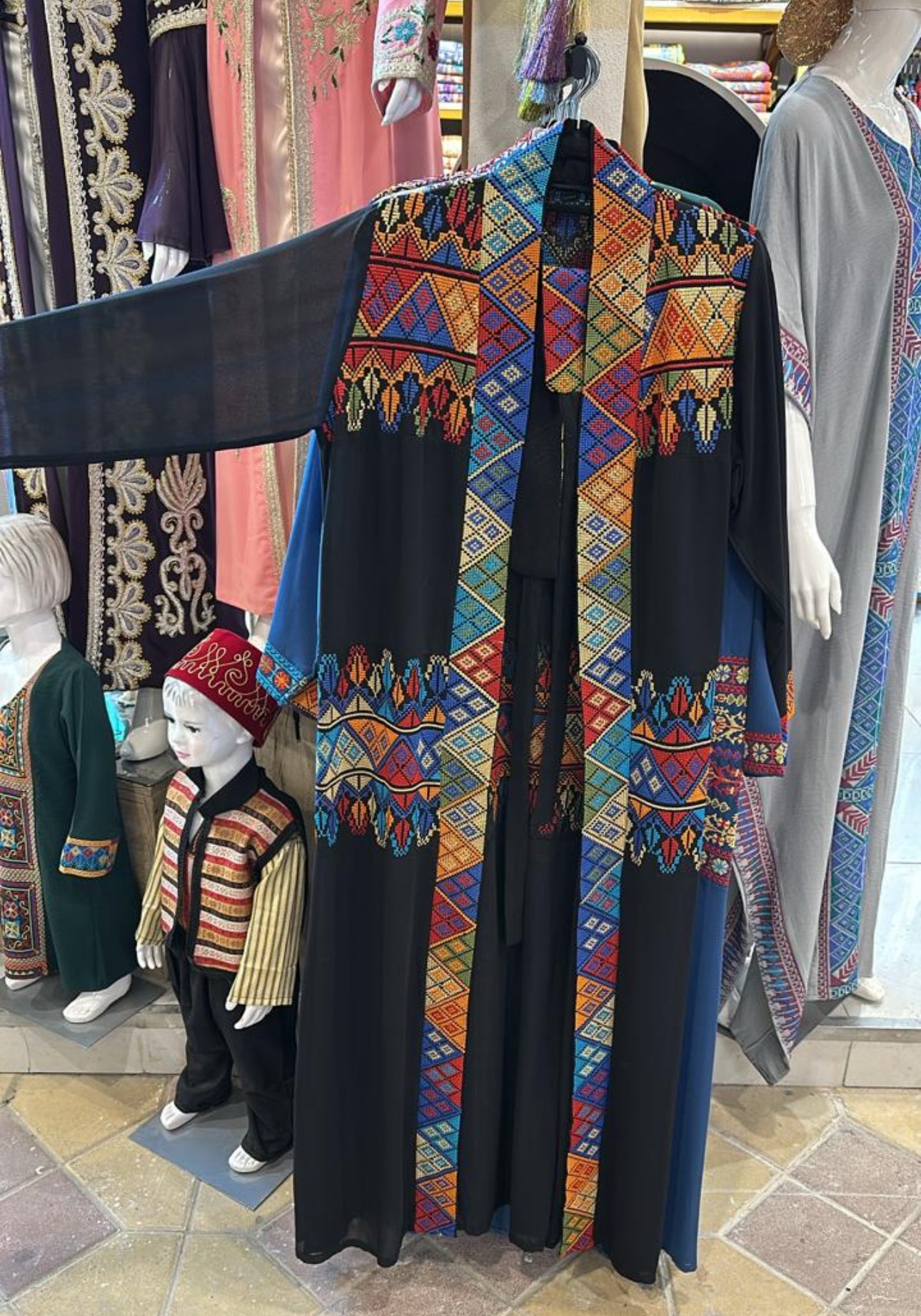 Black Palestinian Tatreez throw with long sleeves and colorful embroidery