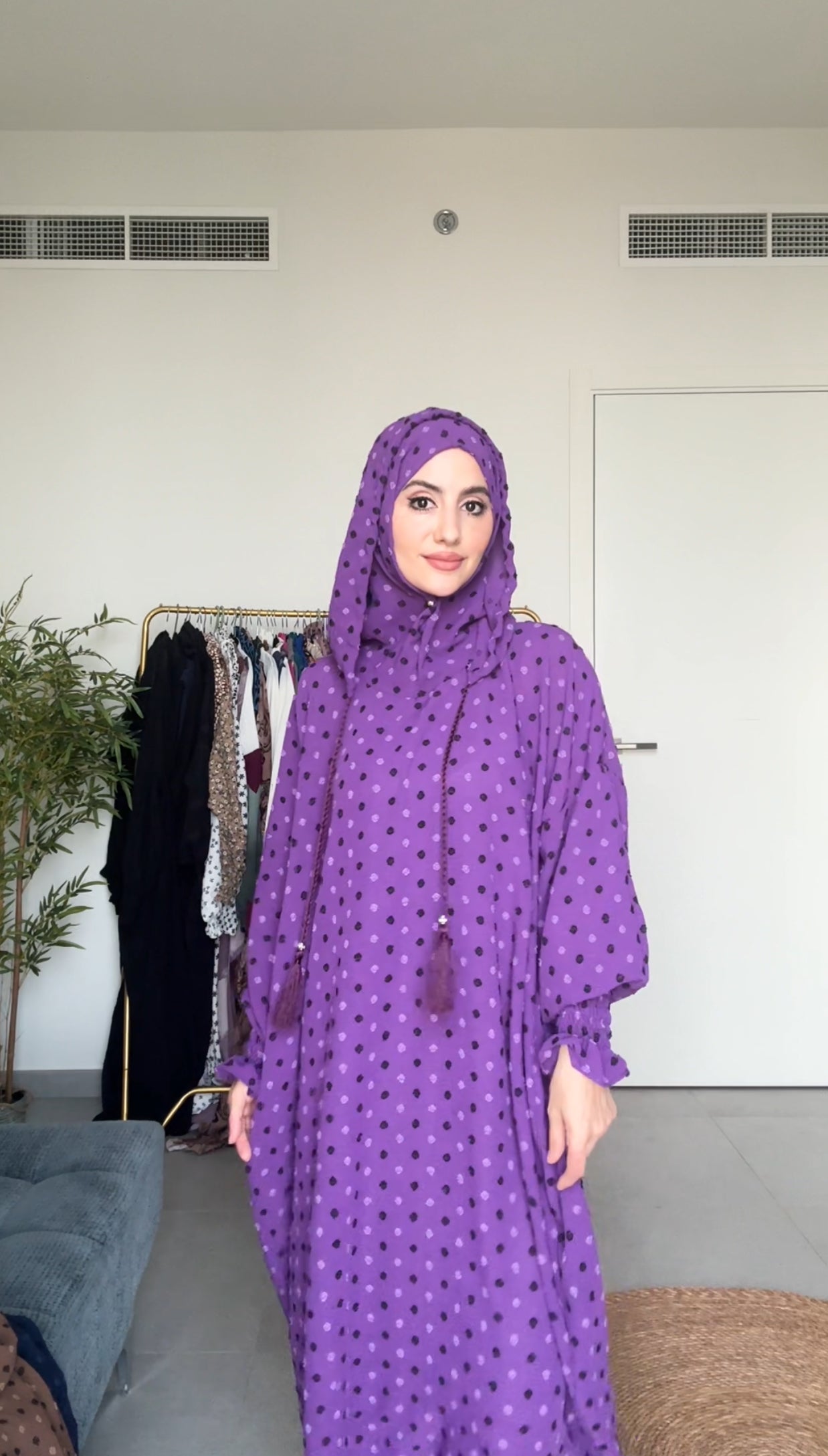 Bright purple burqa with black dots