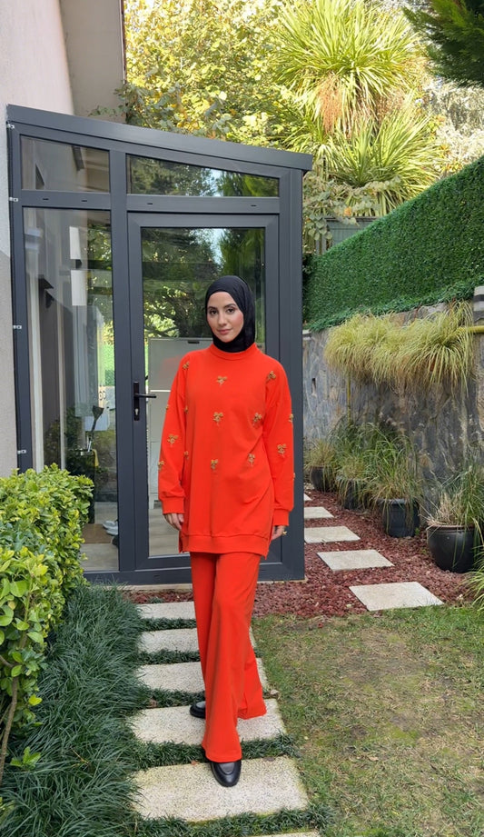 Orange tracksuit set with golden beadwork