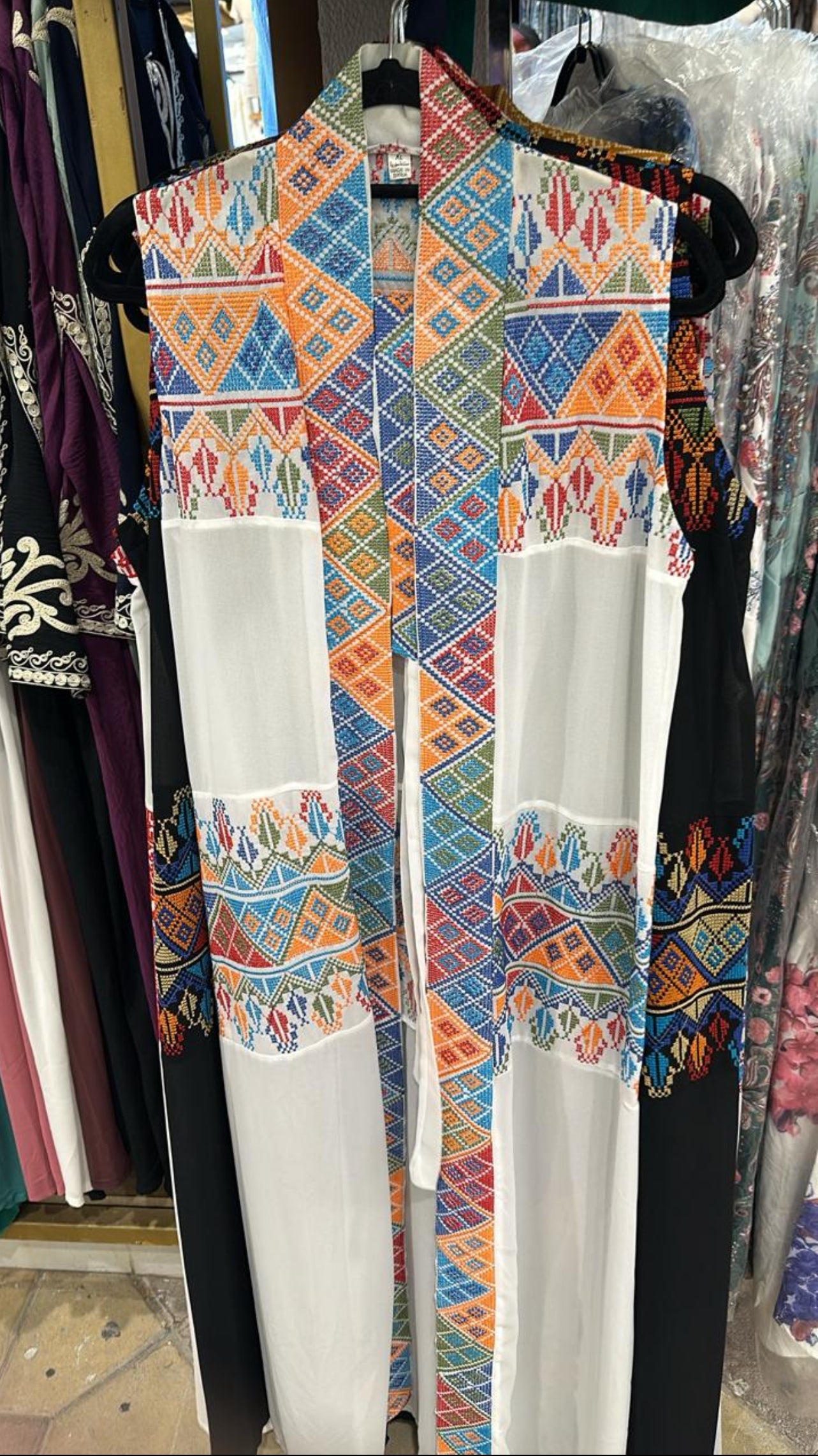 White Palestinian Tatreez throw with half sleeves and colorful embroidery