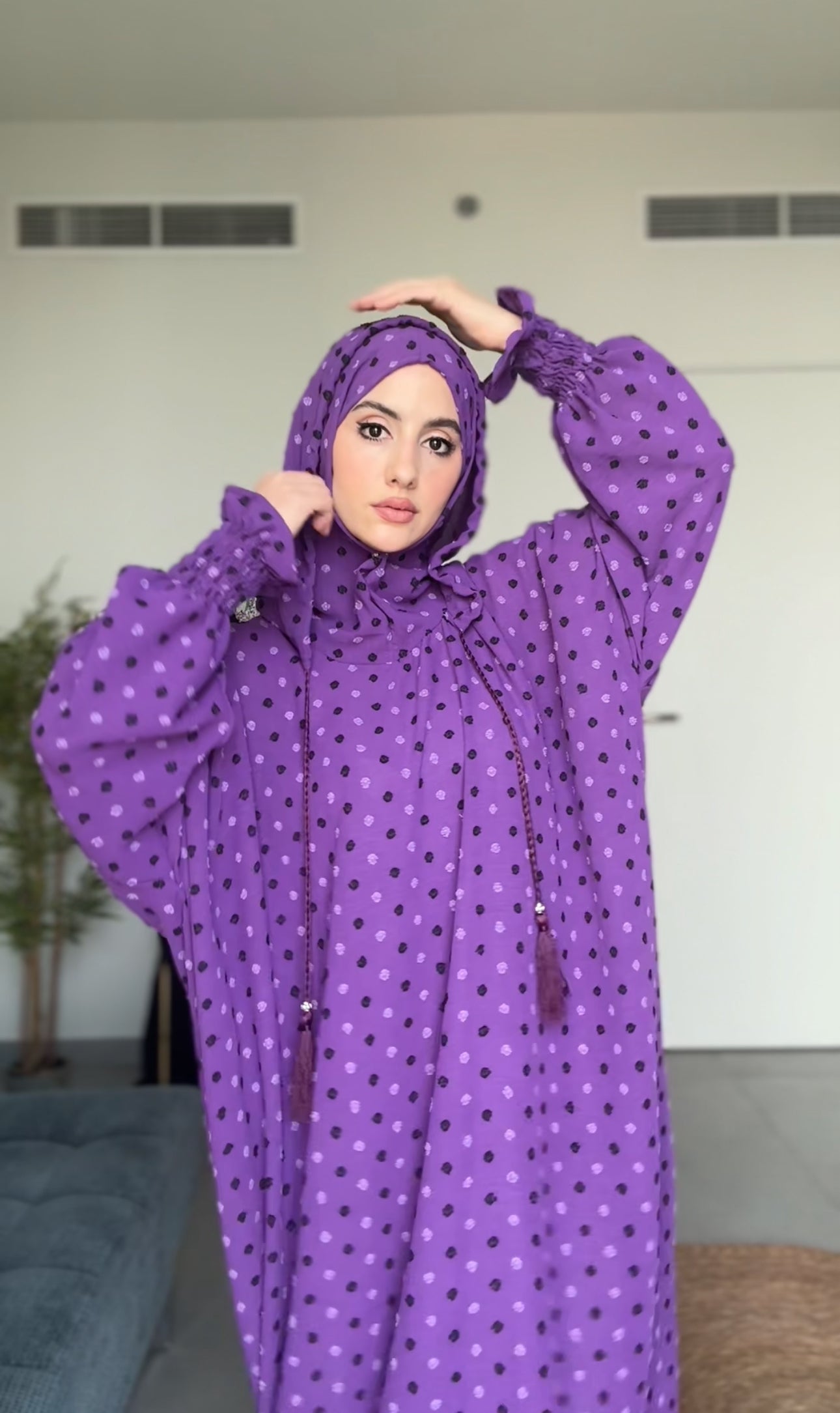 Bright purple burqa with black dots