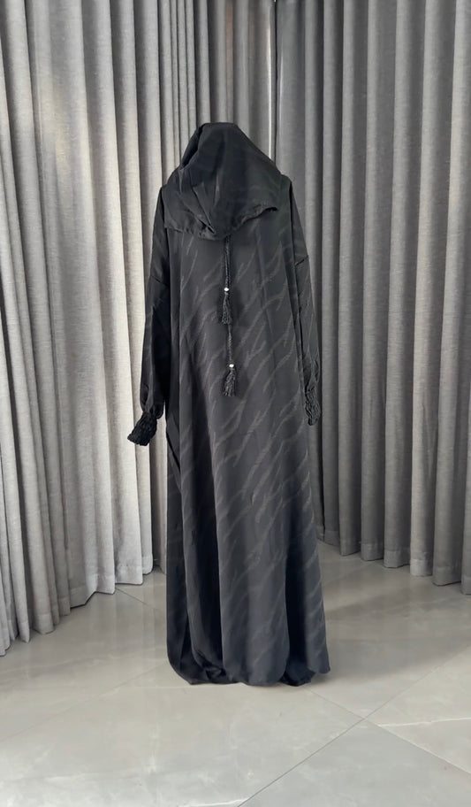 Black burqa with wavy lines