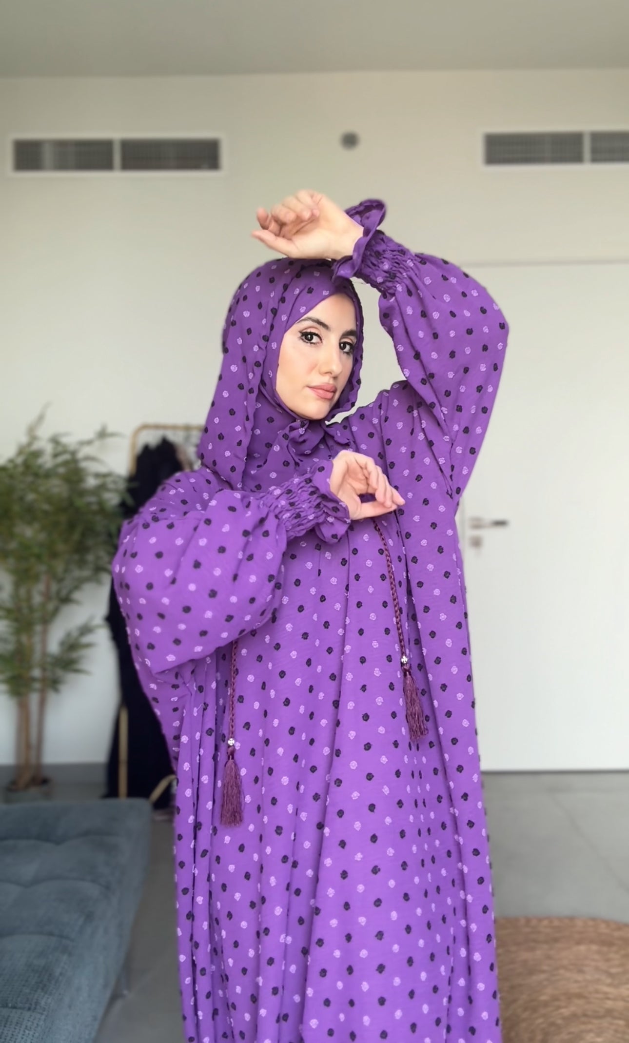 Bright purple burqa with black dots