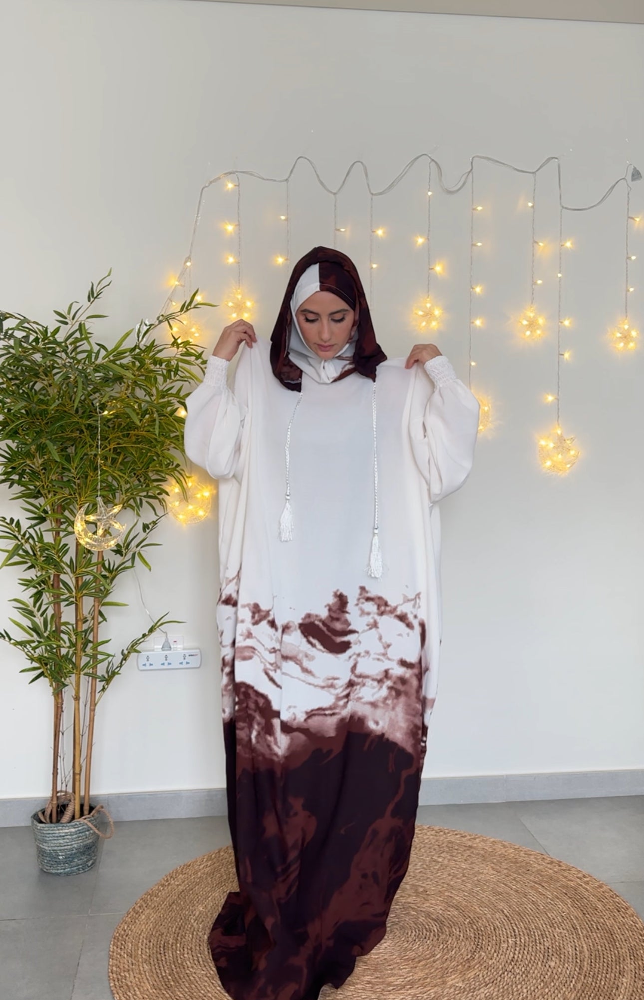 White burqa with brown dye at the bottom