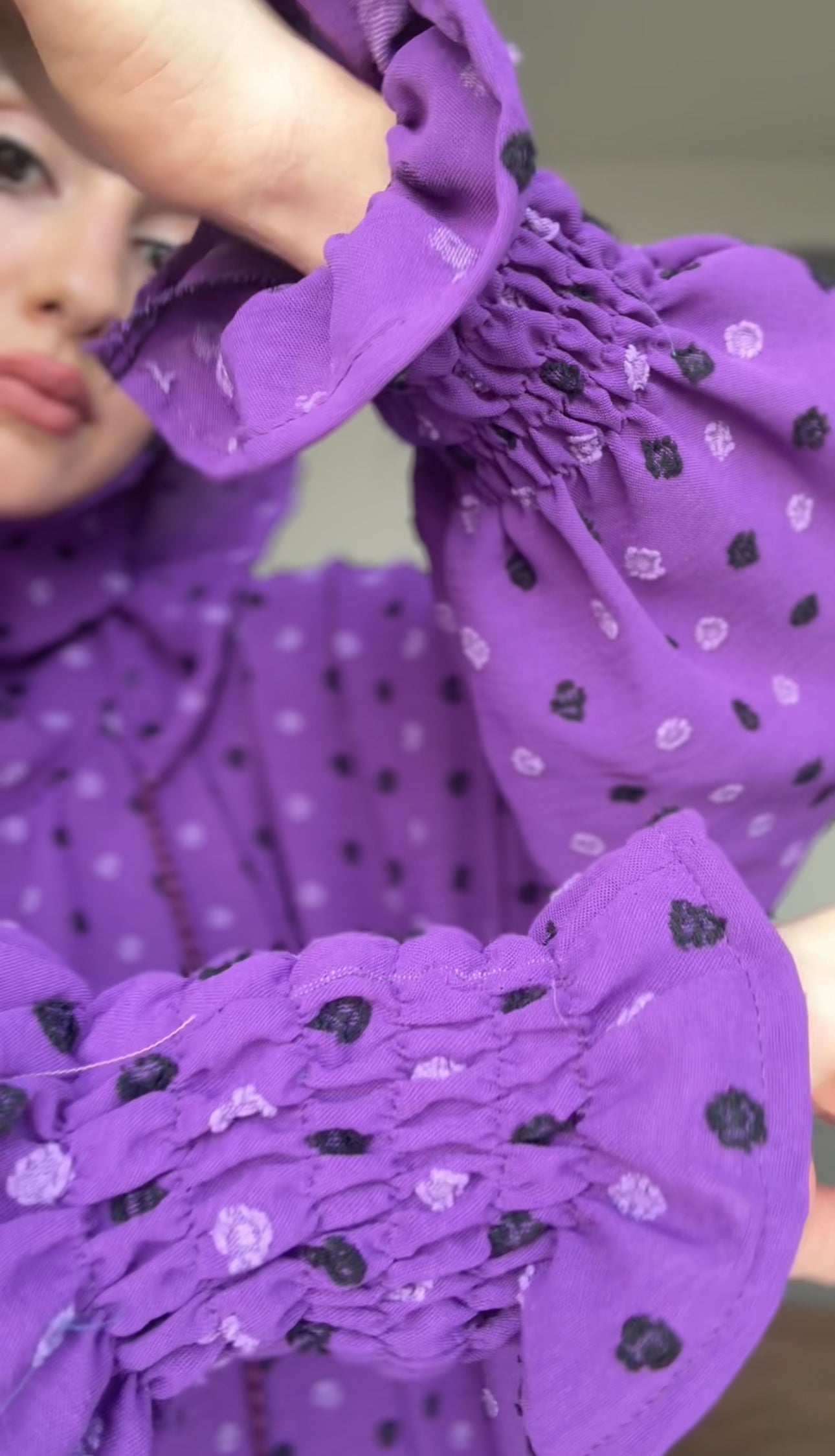 Bright purple burqa with black dots