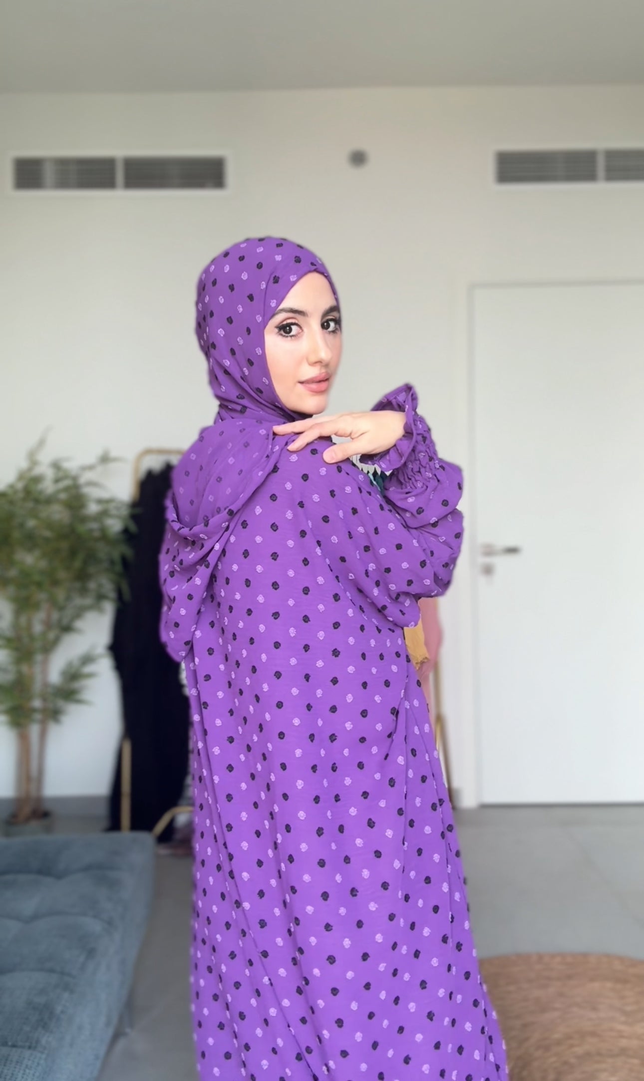 Bright purple burqa with black dots