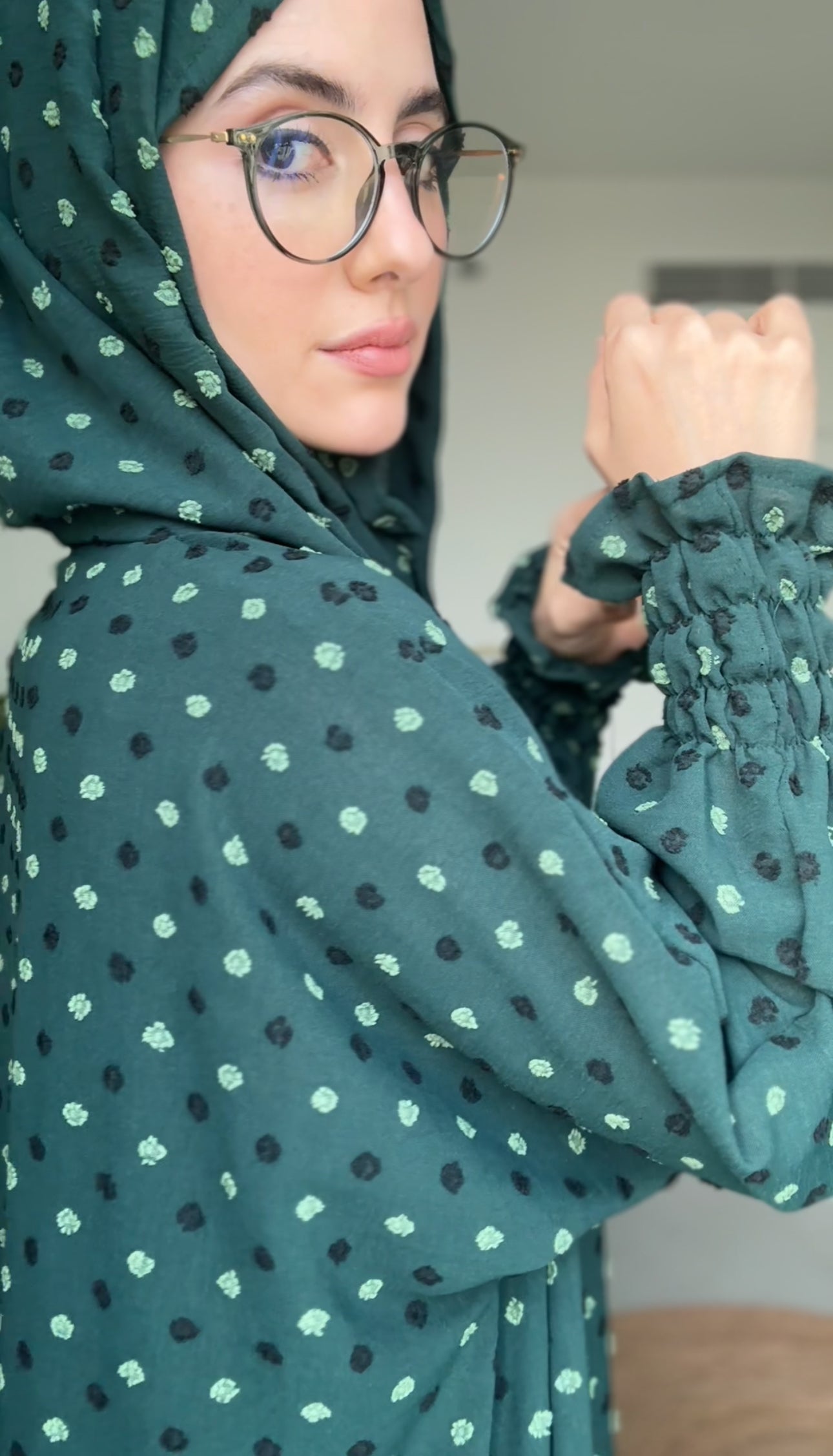 Emerald green burqa with black dots