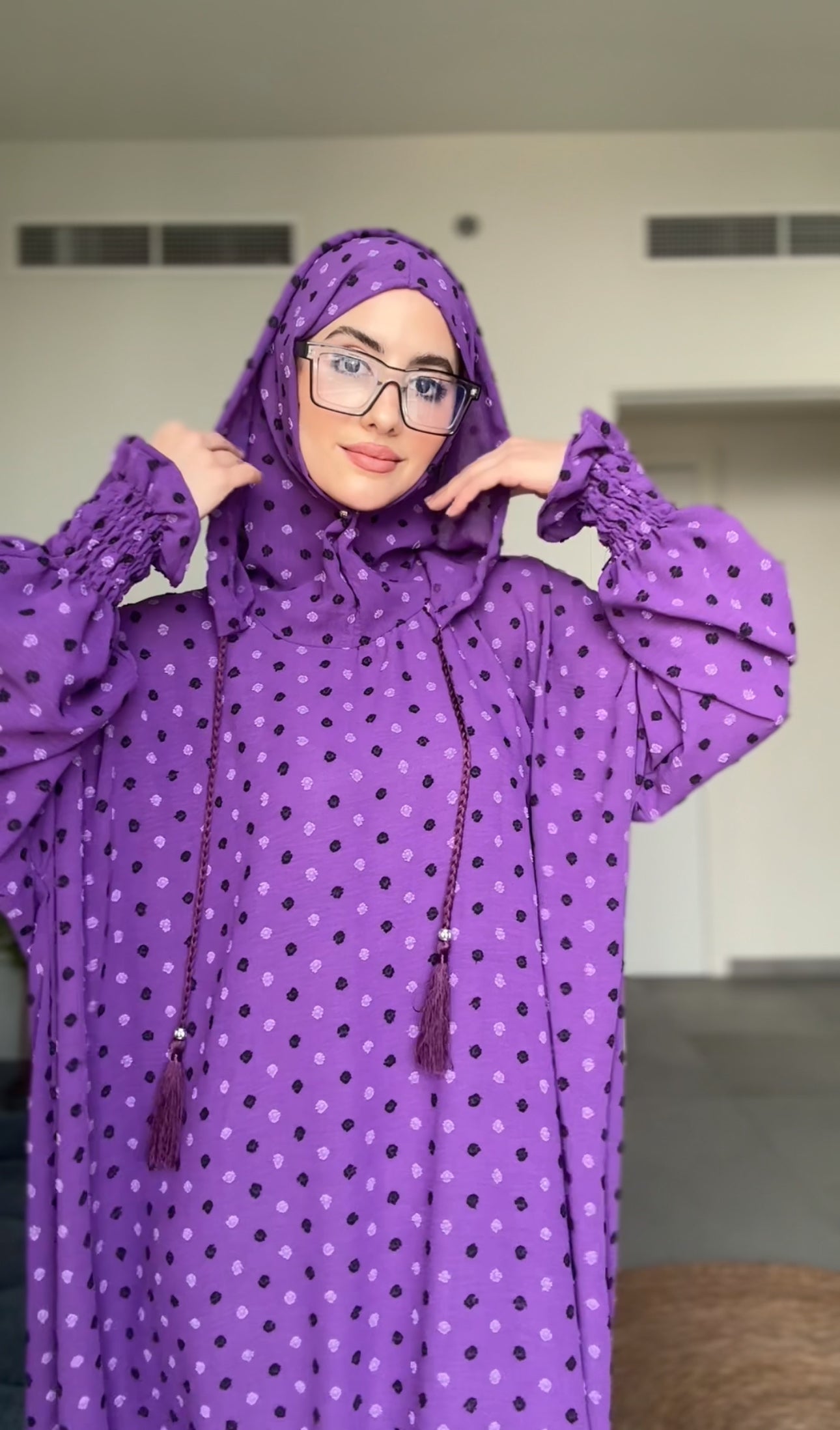 Bright purple burqa with black dots