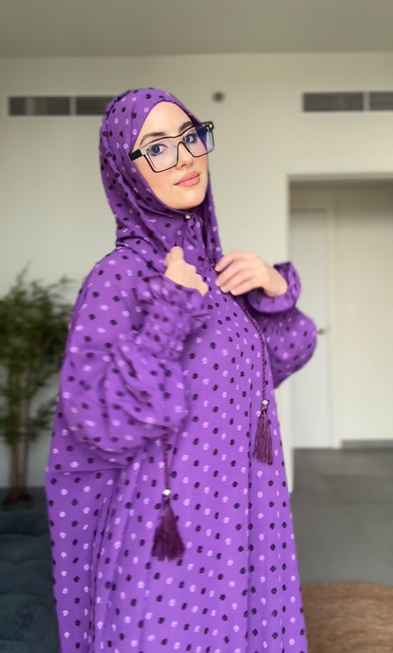 Bright purple burqa with black dots