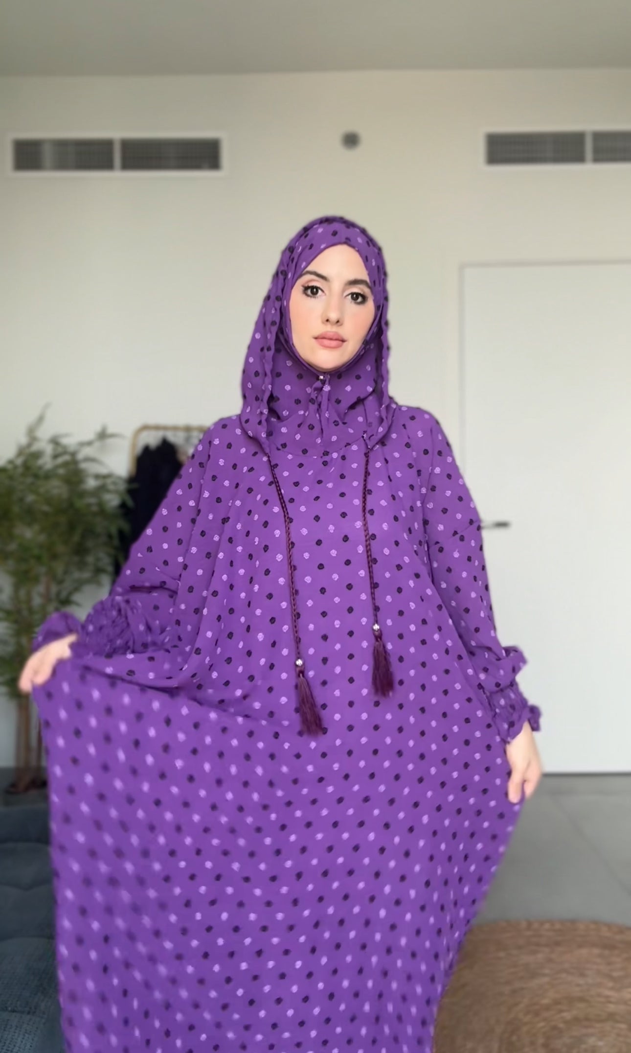 Bright purple burqa with black dots