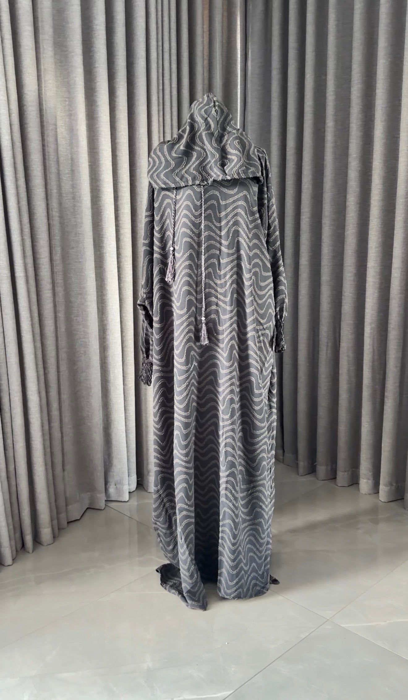 Dark gray burqa with wavy lines