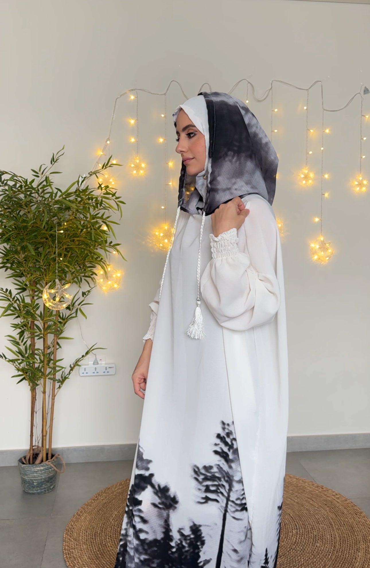 White burqa with black tree pattern at the bottom