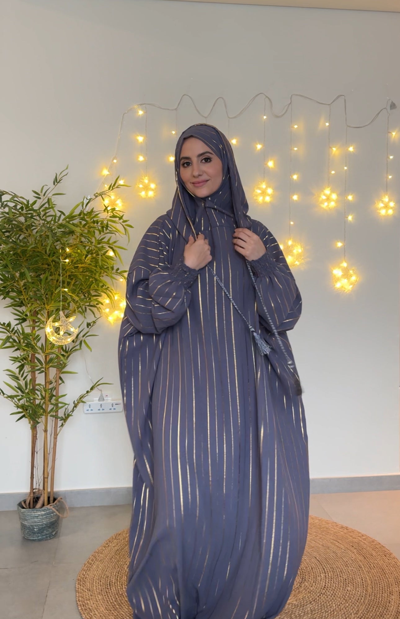 Dark gray burqa with thin gold vertical lines