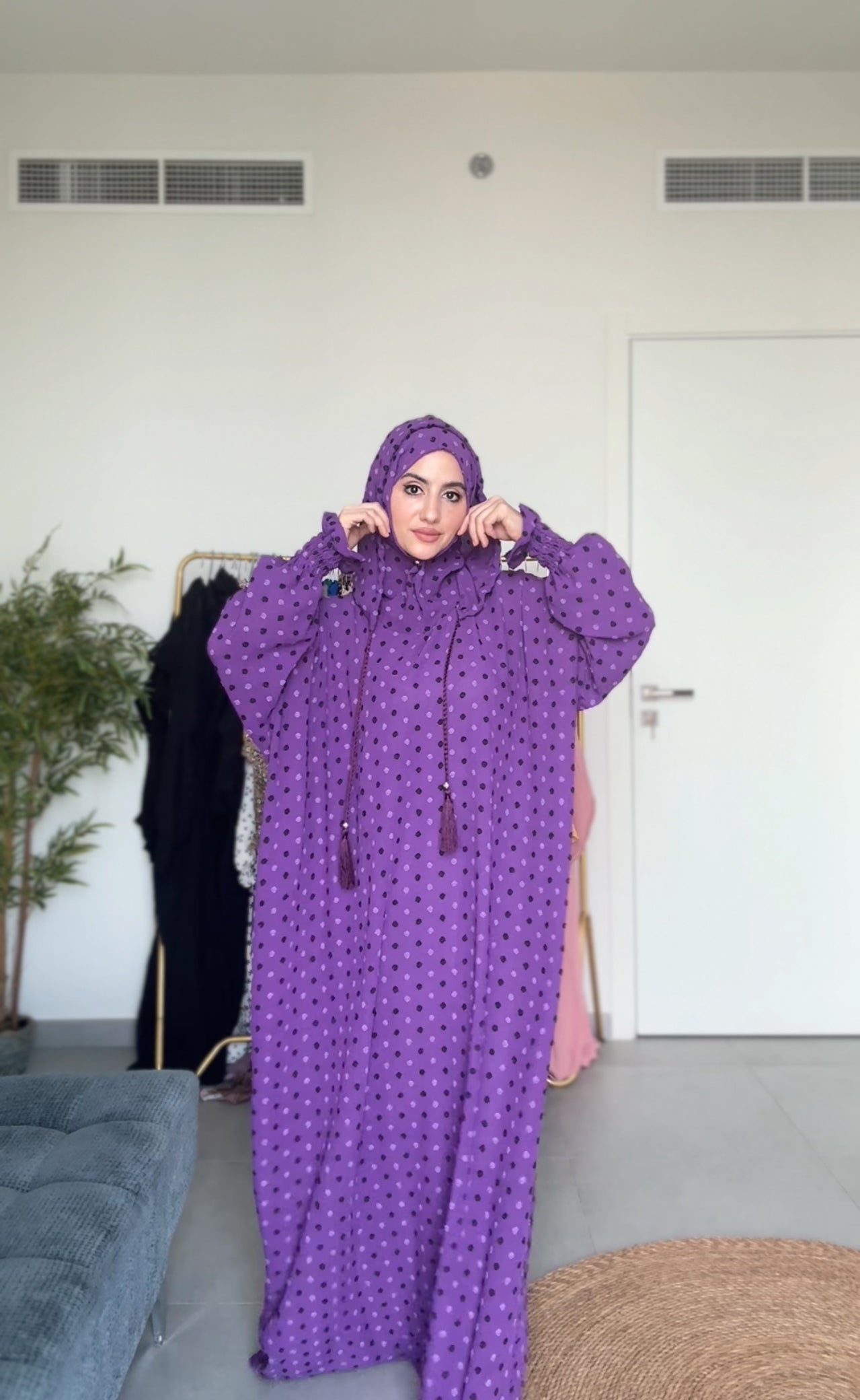 Bright purple burqa with black dots