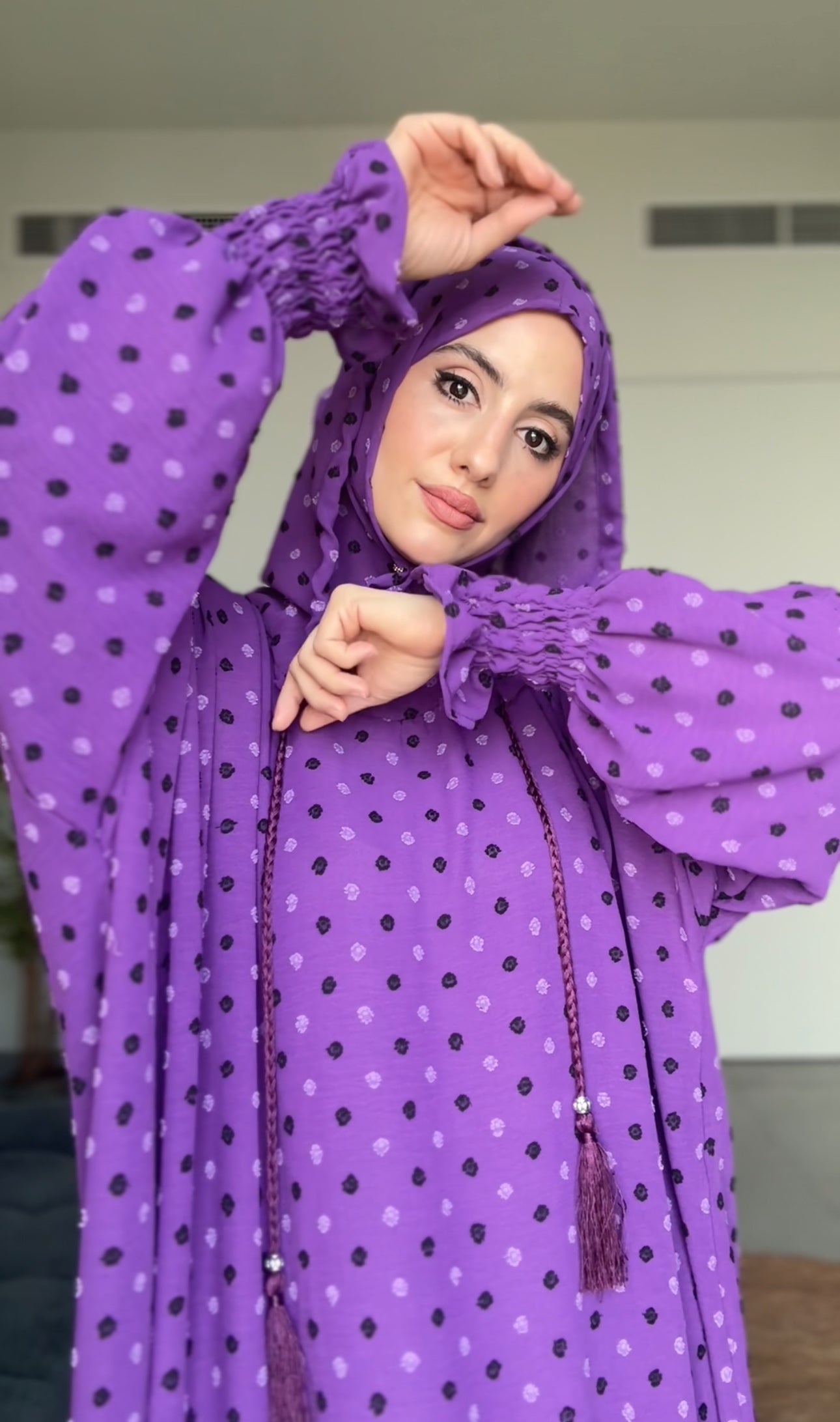 Bright purple burqa with black dots