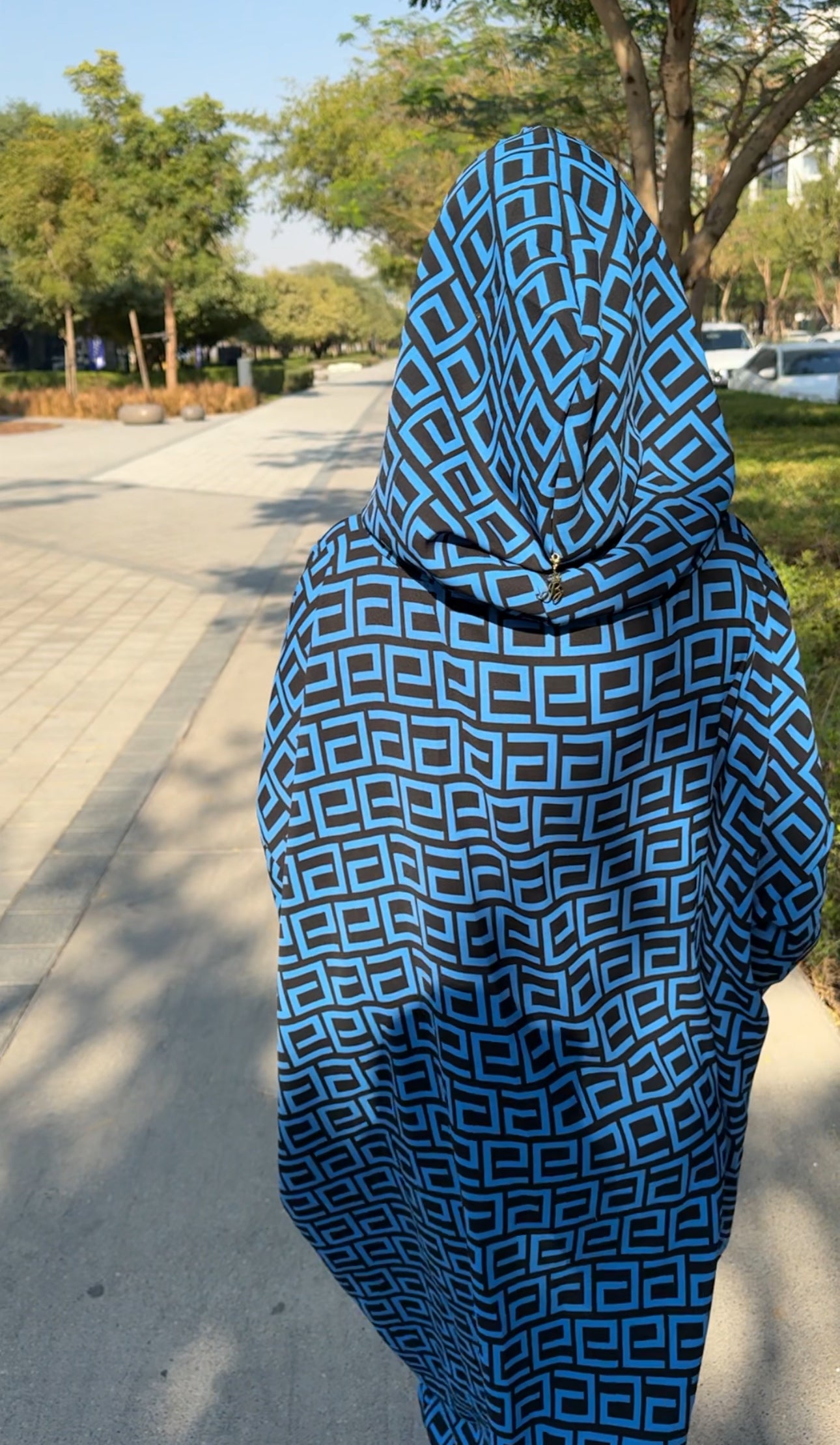 Blue burqa with black geometric lines