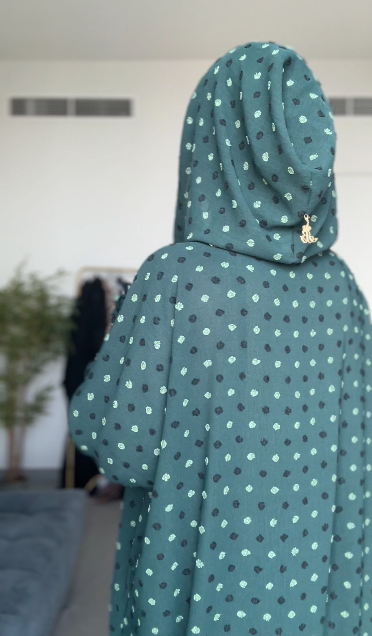 Emerald green burqa with black dots