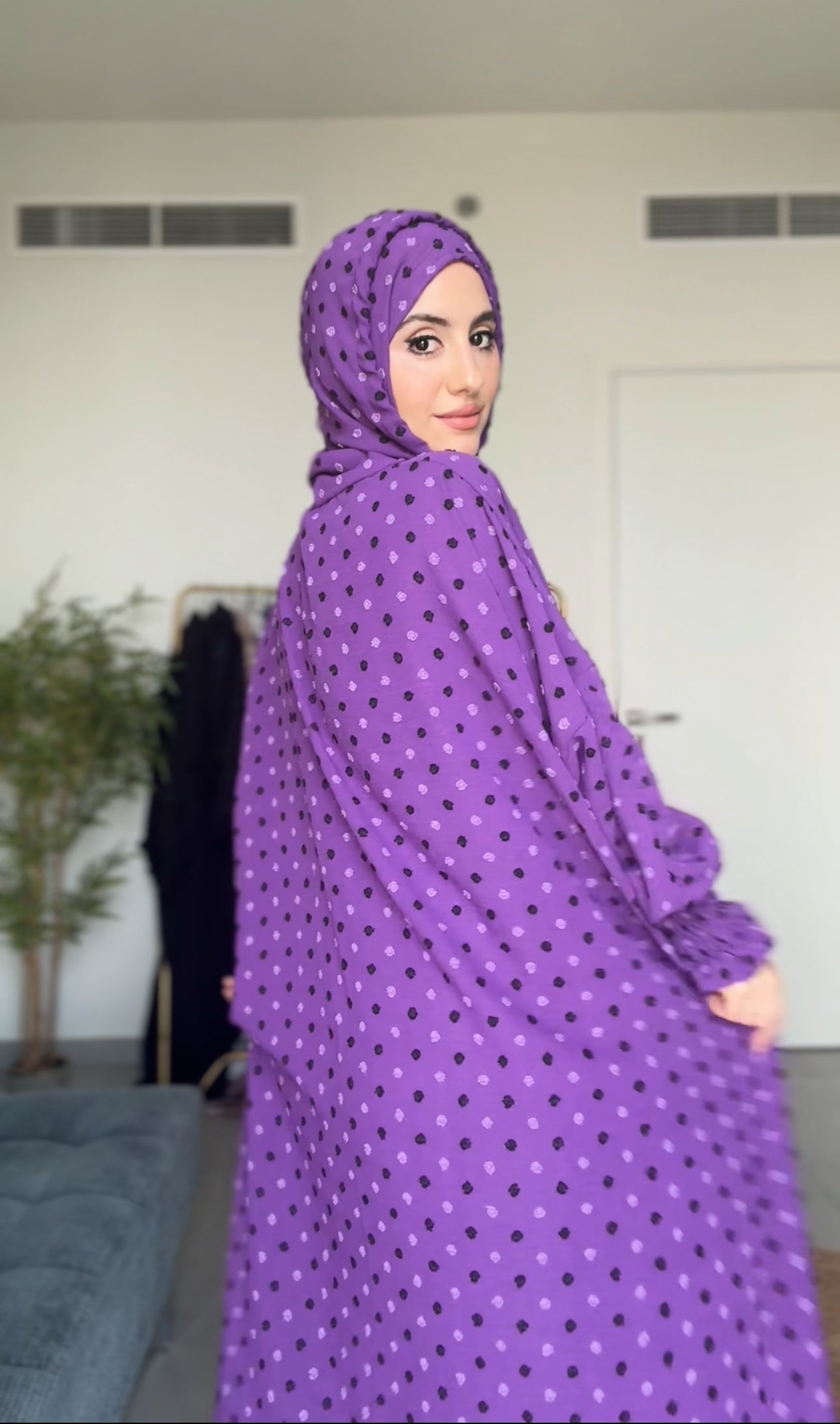 Bright purple burqa with black dots