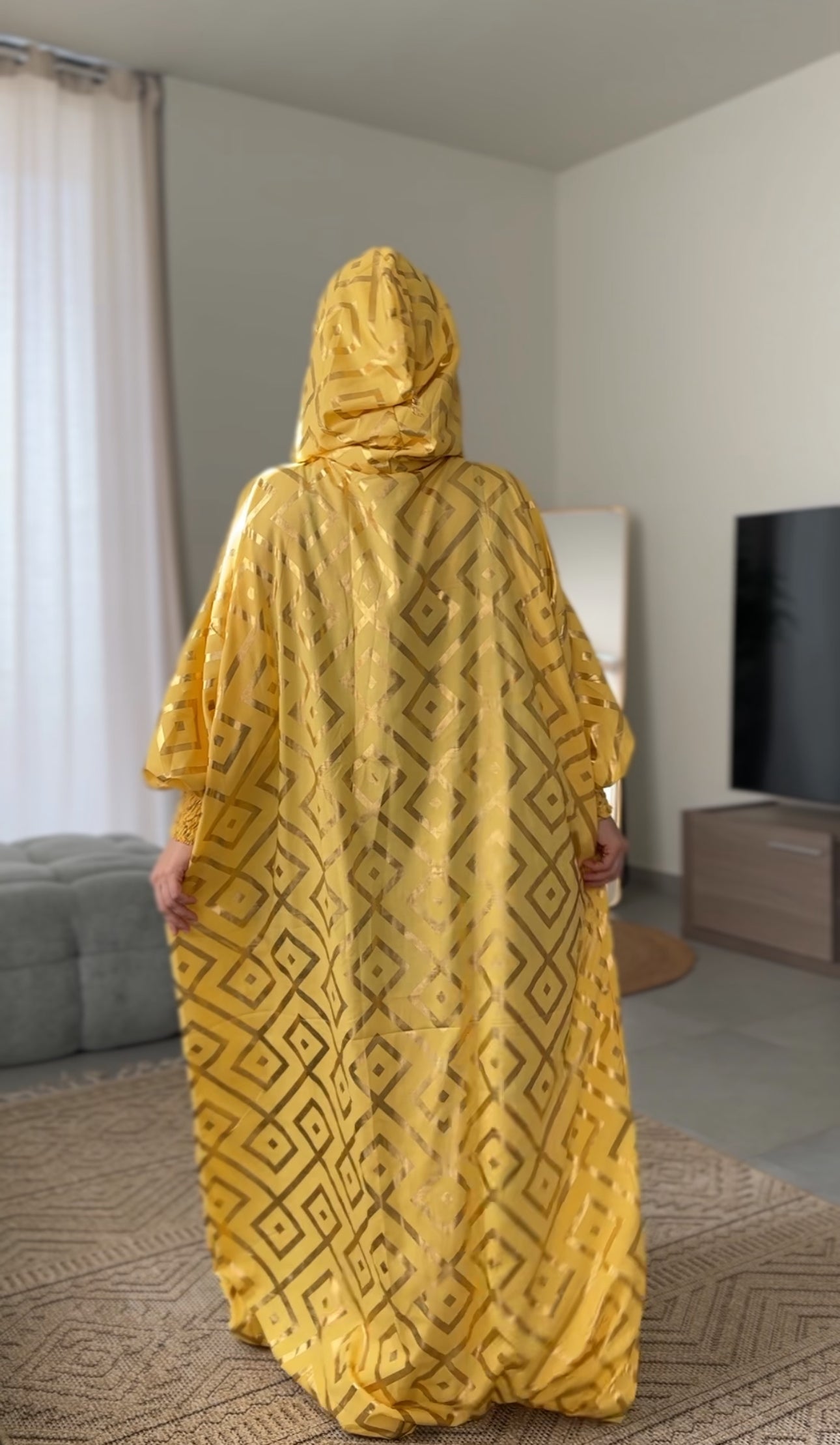 Yellow burqa with gold geometric lines