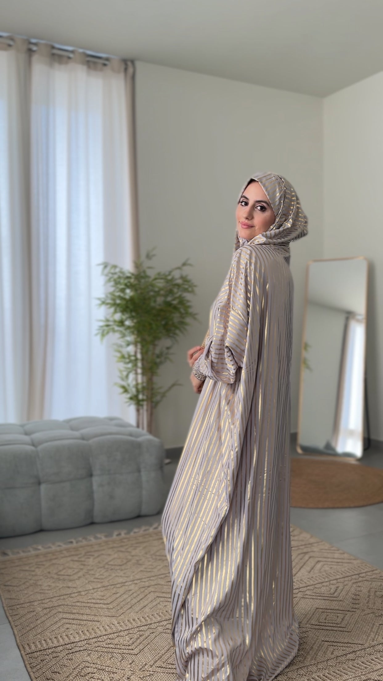 Light grey burqa with thick gold vertical lines