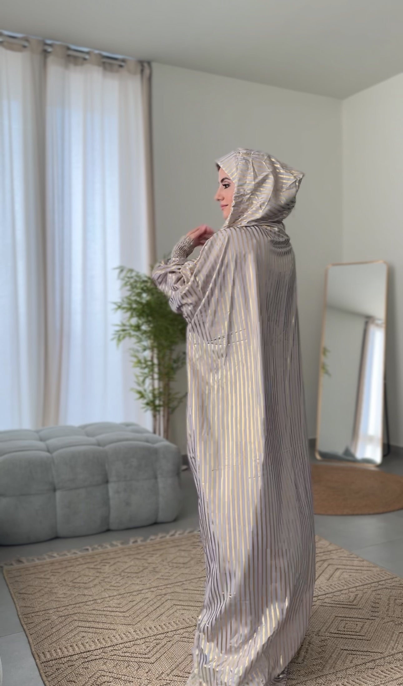 Light grey burqa with thick gold vertical lines